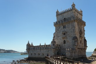 Historic tower with access bridge, blue sky in the background, Torre de Belém, World Heritage Site,