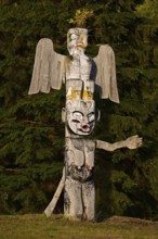 Kwakwakawakw totem pole at the cemetery in Alert Bay, Cormorant Island, British Columba, Canada,