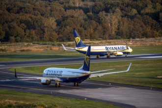 Ryanair Boeing 737 taxis to the runway, another Ryanair aircraft taxis for take-off, Cologne-Bonn