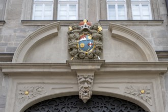 Coat of arms cartouche from 1693 above the portal of the Knauf Museum, market square, Iphofen,