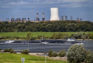 Rhine at Duisburg-Beeckerwerth, freighter loaded with coal, cooling tower, of the STEAG coal-fired