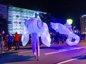 Walking act, underwater, stilt artists float gracefully across the festival as fish, octopus or