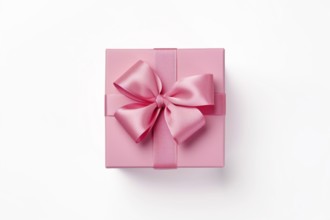 Top view of pink gift box with ribbon on white background. KI generiert, generiert AI generated