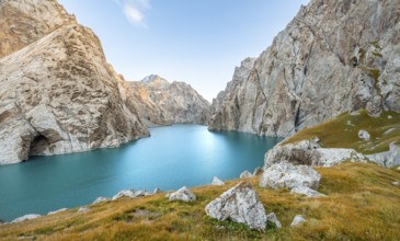 Turquoise mountain lake Kol Suu with rocky steep mountains, Kol Suu Lake, Sary Beles Mountains,