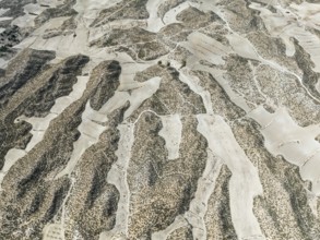 Farmland amongst rocky outcrops. Aerial view. Drone shot. Granada province, Andalusia, Spain,