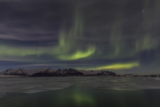 Northern Lights, Aurora borealis over glaciers and Jökulsarlon, Vatnajökull, Iceland, Europe