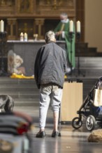 A mentally confused homeless man in the church, family mass with blessing of animals in St Agnes,