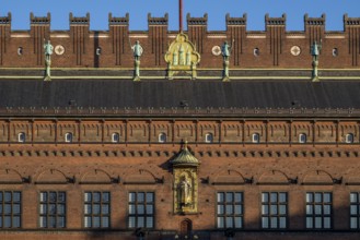 Brick façade with gilded sculpture of Bishop Absalon, Town Hall in the National Romantic style by