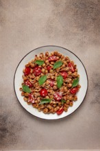 Tuscan pasta with smoked paprika and basil, parmesan cheese, Italian traditional cuisine