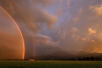 Wild clouds with rainbow in front of mountains, evening light, Loisach-Lake Kochel-Moor, Alpine