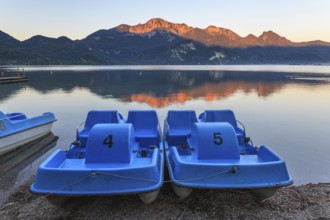 Mountains reflected in lake, pedal boats, morning light, summer, silence, Lake Kochel, Alpine