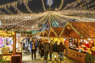 Pre-Christmas season, people, shoppers, visitors to the Christmas market in the city centre of