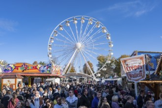 Crowd of people on fairground, amusement park, amusement ride, Ferris wheel, showmen, on the