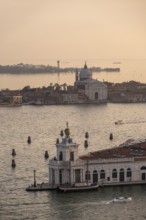 Punta della Dogana and church Chiesa del Santissimo Redentore on the island of Guidecca at sunset,