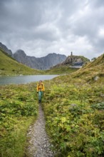 Wolayersee and Wolayerseehütte, hiker on the Carnic High Trail, Carnic Alps, Carnic Alps main