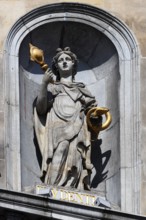 Historic City Hall Stadhuis on the Grote Markt, detailed view of allegorical statue of Prudentia