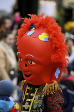 Colourful mask painted with confetti at the carnival parade of the Wey guild on Rose Monday,