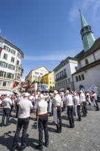 Historically costumed guildsmen in Zurich's Old Town, stand concert at Münzplatz, Zunft zum Weggen,