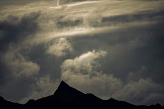 Summit in the morning light with dramatic clouds, Lech, Lechquellengebirge, Vorarlberg, Austria,