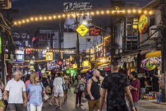 Crowds of people on Bangla Street in the evening. Nightlife on Bangla Walking Street with go-go