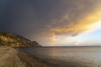 A thunderstorm with rainbow on the beach of Sougia in the south of Crete, Greece, Europe