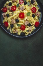 Tuna salad, fusilli pasta, olives and cherry, olive oil, homemade