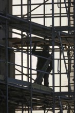 Scaffolders erecting scaffolding, November, Germany, Europe