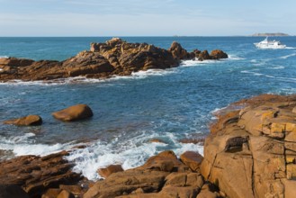 Coastline with rocks and passing boat under clear sky, Ploumanac'h, Ploumanach, Perros-Guirec,