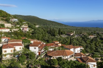 View over rooftops of homes in village of Vuno, near Himare, Albania, Europe view towards Ionian