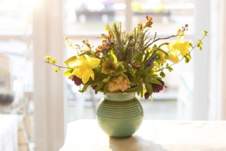 Bouquet of flowers in a vase, atmospheric in the morning light