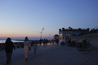 Tourists on the promenade on the beach on the island of Borkum, 19.07.2024