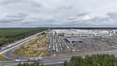 Tesla Giga Factory on the A10 motorway, in the centre of the picture is a photovoltaic system above