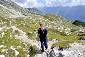 Ten-year-old boy hiking, Nebelhorn, Allgäu Alps, Bavaria, Germany, Europe