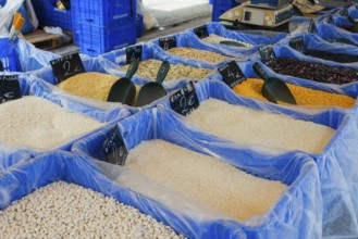 Variety of rice and pulses in large containers at a market, market, Nafplio, Nauplia, Nauplion,