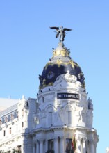 Metropolis building cupola dome with gold and winged angel, Madrid city centre, Spain, architects