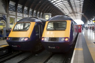 Two First diesel locomotive trains, Paddington railway station, London, England, United Kingdom,