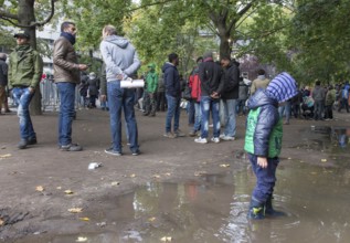 Refugees from Syria waiting to be registered at the Central Reception Centre for Asylum Seekers at