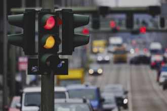 A traffic light lights up yellow and red, taken in Berlin, 27/02/2024