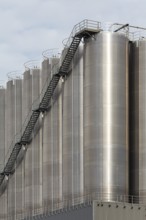 High silo facility for bulk goods, aluminium silo with external staircase, Parallelhafen,