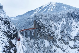 Rhaetian Railway train at the famous Landwasser Viaduct on the Albula railway Stadler Rail