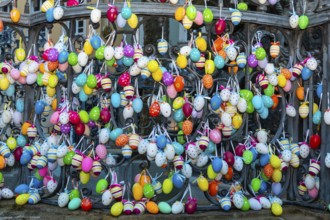 Easter eggs hanging from a fountain railing, Bamberg, Lower Franconia, Bavaria, Germany, Europe