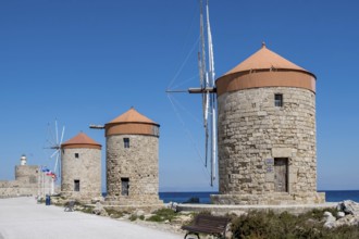 Windmills on the pier at Mandráki harbour, Rhodes Town, Rhodes, Dodecanese, Greece, Europe