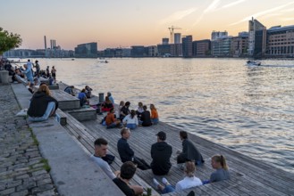 Summer evening in Copenhagen, at the harbour, Islands Brygge, people celebrating, eating, drinking,