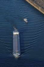 Cargo ship, inland waterway vessel, on the Rhine near Düsseldorf, Rhine knee bridge, water police