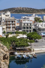 The village of Agios Nikolaos, in the eastern part of Crete, view over Lake Voulismeni, connected