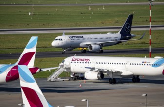 Düsseldorf Airport, Lufthansa Airbus A320-200 on the taxiway, Eurowings Airbus A319-100 in parking