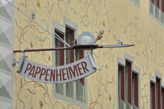 Nose sign on the historic building Pappenheimer with wall painting and decorations, lance with