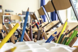 Classroom of a fourth grade, after school, the building is older but in good condition, coloured