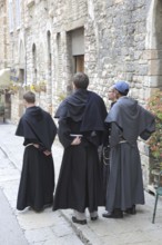 Monks and priests in the historic centre of Assisi, Umbria, Italy, Europe