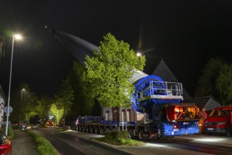 Transport of a 68 metre long, 22 tonne blade of a wind turbine, here in Breckerfeld-Waldbauer, with